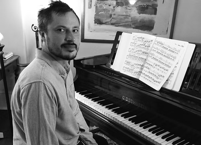 Eric Greenwood at his Bechstein grand piano in the home studio